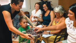 Alisha Garber and son Asher share communion with members of the Mennonite Evangelical Community of Barcelona. — Joshua Garber