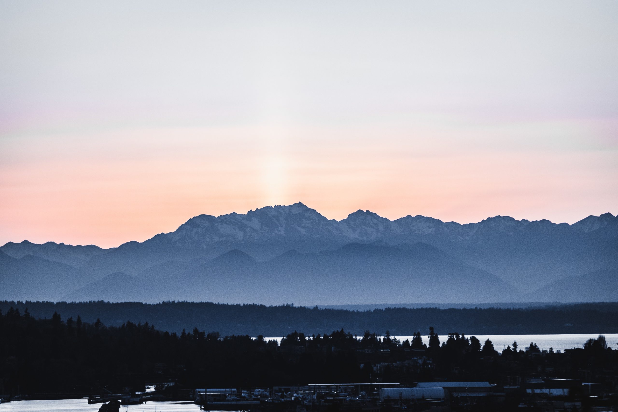 Sunset over the Olypmic Mountains by David H on Unsplash.com