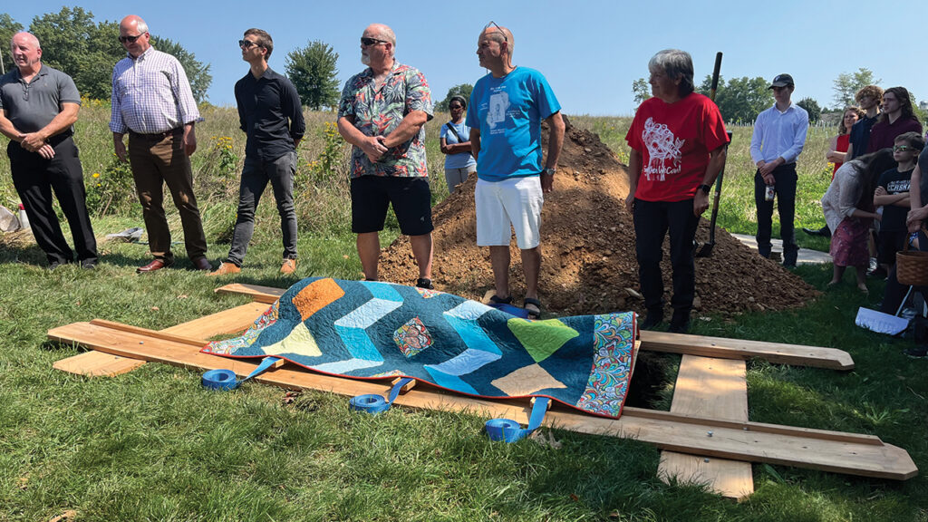 Frank Albrecht’s green burial at Akron Mennonite Church’s pine trees. — Courtesy of Elizabeth Soto Albrecht