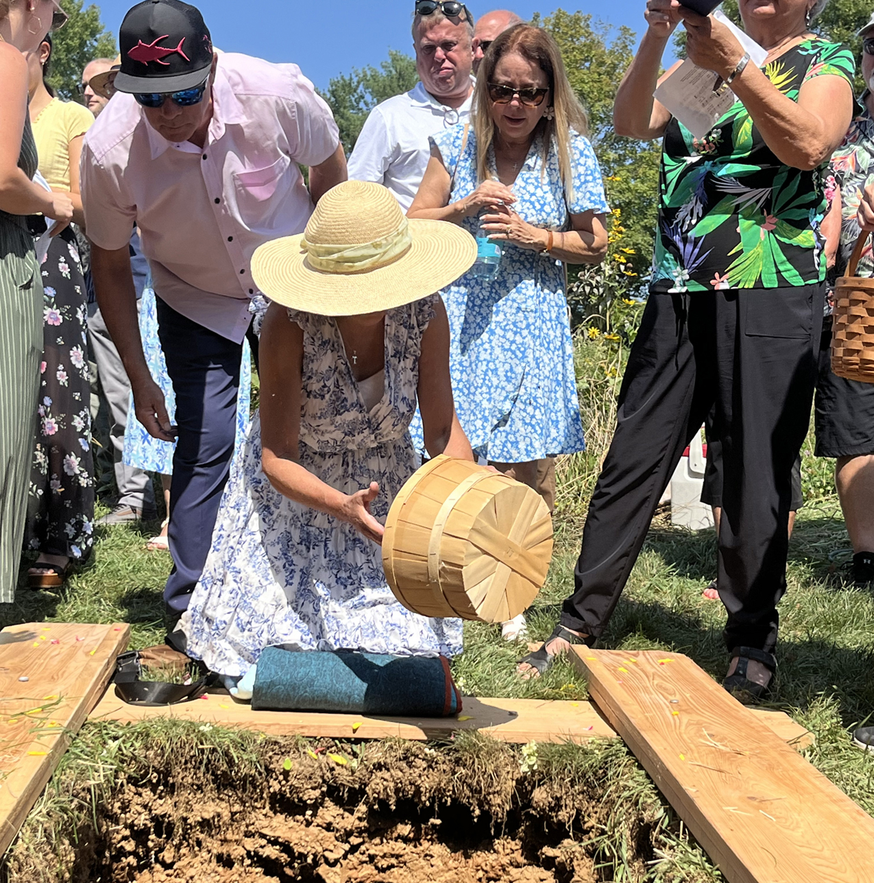 Elizabeth Soto Albrecht scatters flowers on her husband’s grave. — Courtesy of Elizabeth Soto Albrecht