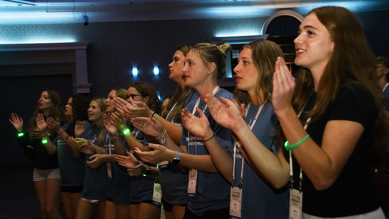 Youth participate in an evening worship service. — Juan Moya/AW