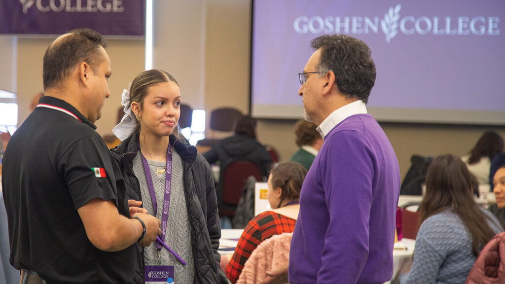 Gilberto Pérez Jr., vice president for student life and Hispanic-serving initiatives, talks with a prospective student and her father during Descubre/Celebrate Scholars Day at Goshen College on Jan. 25. — Goshen College