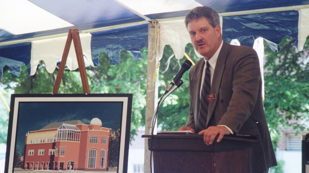 Bethel College President Doug Penner speaks during the groundbreaking for Krehbiel Science Center in 2000. — Bethel College