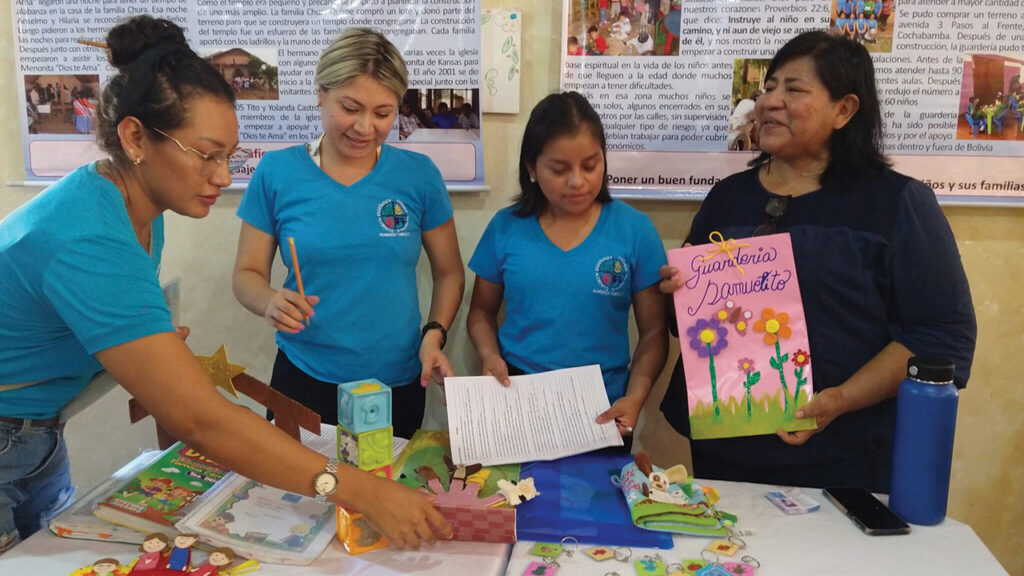 Isabel Marín, Nicol Anzoategui, Vilma Po and Inocencia Ortiz from the Bolivian Mennonite Evangelical Church’s community daycare center Guardería Samuelito share about their ministry in a space for participants to learn about the ways the congregations are involved in ministry. — Linda Shelly/MMN