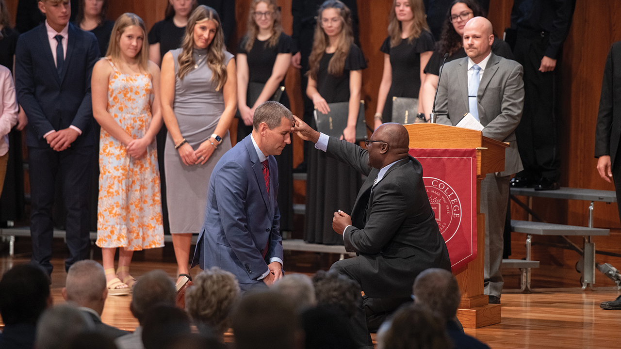 Mark Landes is anointed with oil by Ron Moyo, a pastor at Whitestone Mennonite Church, during his inauguration as Hesston College’s 10th president Sept. 27 at Hesston Mennonite Church. Moyo and fellow Whitestone pastor Isaac Landis, right, are Hesston graduates. — Larry Bartel/Hesston College