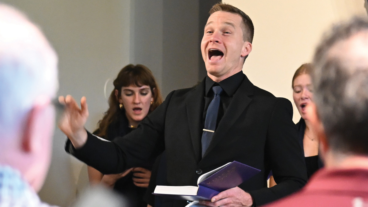 Eastern Mennonite University associate professor of music and Voices Together music editor Benjamin Bergey leads singing Sept. 27 at Hyattsville Mennonite Church. — Kyla Hanington