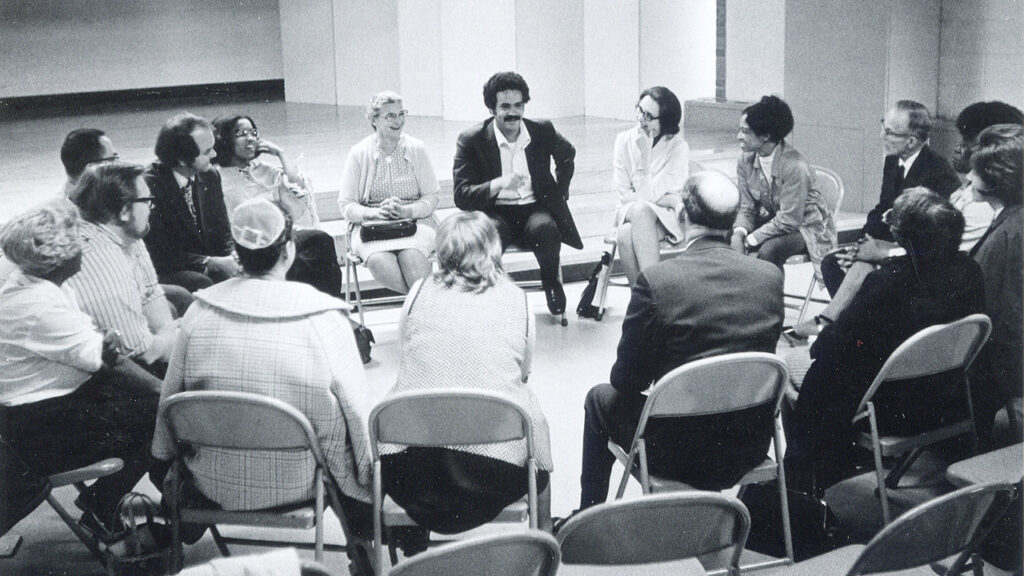 In a photo from the mid-1970s, Neftali Torres leads worship for the inter-Mennonite program “In Search of Peace.” — Mennonite Church USA Archives