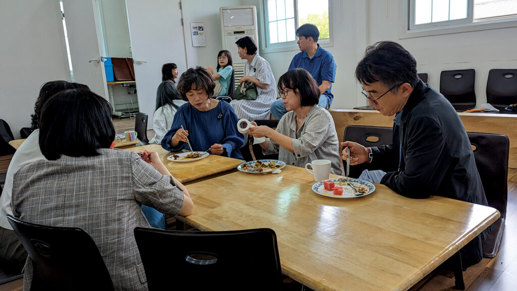 Jesus Village Church in Chuncheon, South Korea, hosts a carry-in meal on June 4, 2023, after a joint worship service with Jesus Heart Church, a fellow Anabaptist congregation in the city, which is the present home of the Korean Anabaptist Center. The congregations were hosting participants in a Mennonite Central Committee learning tour focused on legacies of the Korean War. — Tim Huber/AW