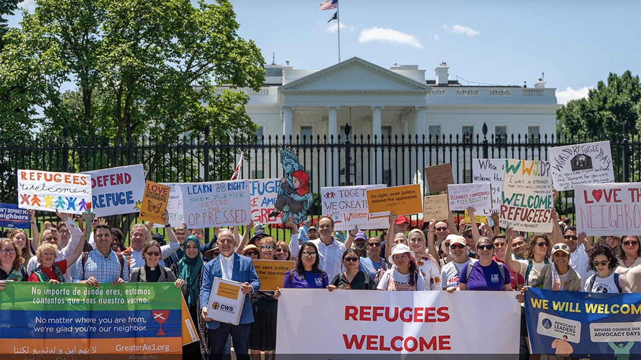 Church World Service demonstrators support refugees in June outside the White House in Washington, D.C. — Church World Service