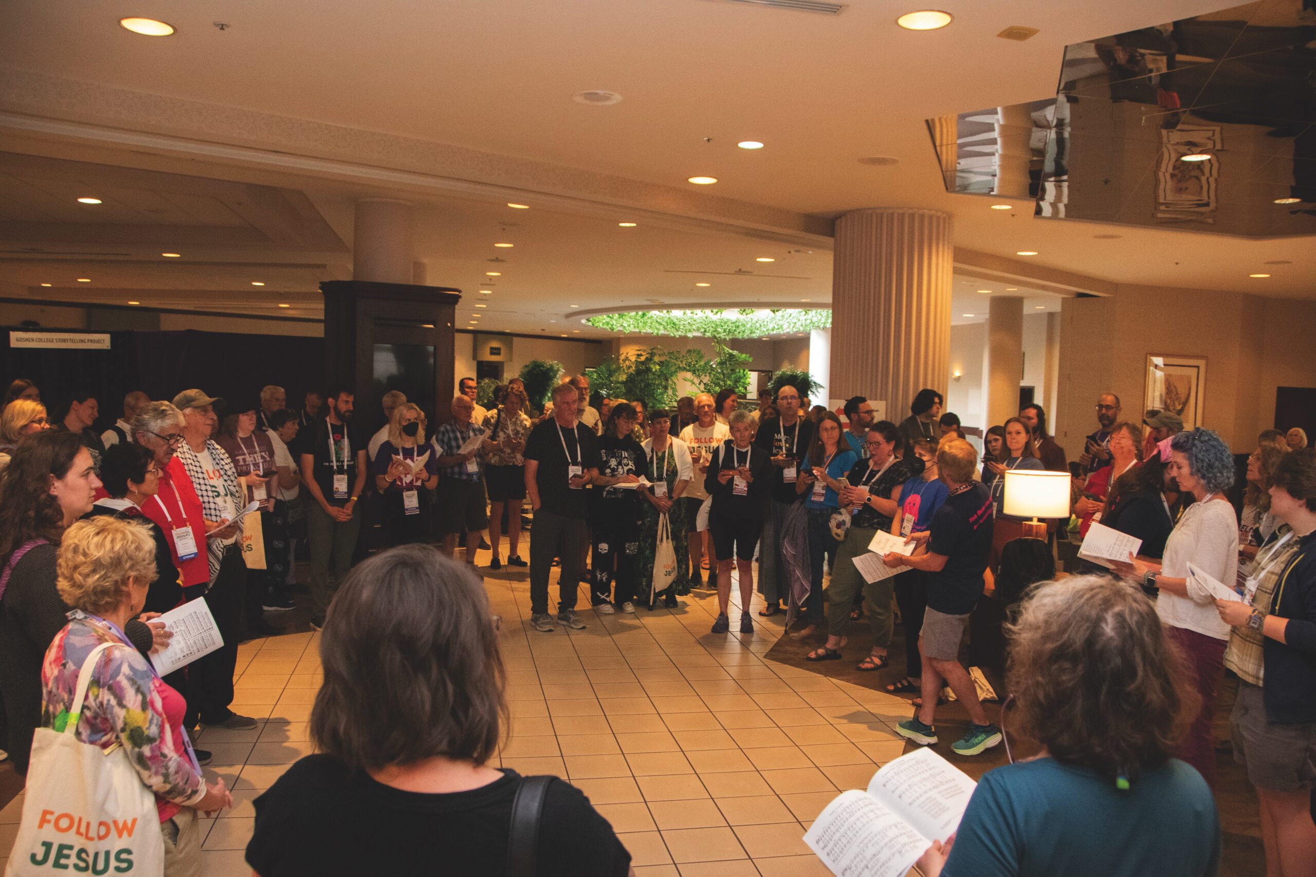 People sing hymns in a hallway during the Mennonite Church USA convention in Greensboro, N.C.
