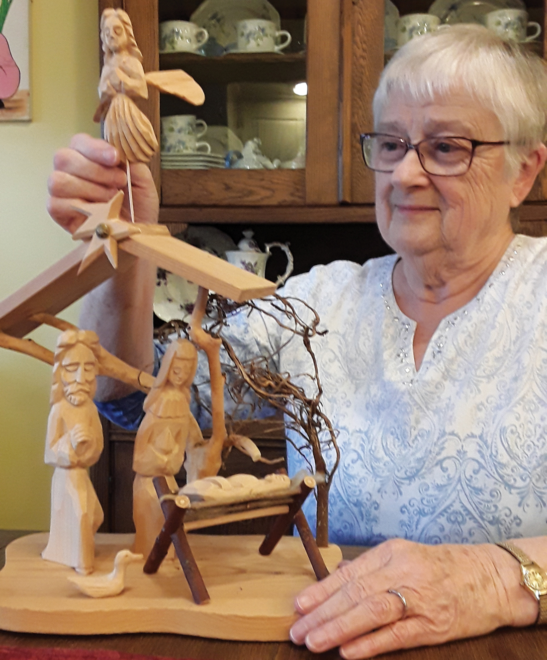 Shirley Yoder Brubaker with a creche from Lithuania. — Courtesy of Shirley Yoder Brubaker