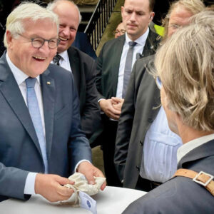 Bernhard Thiessen, right, gives Frank-Walter Steinmeier a bag of Turkey Red wheat. — Brigitte Schulz