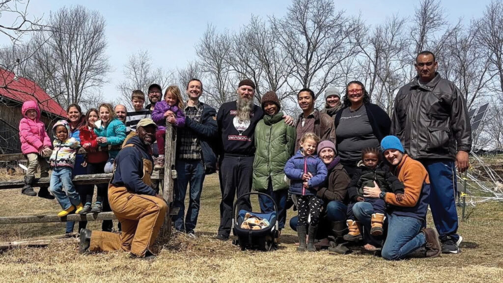 Jason and Vonetta Storbakken, center, with the Manhattan Mennonite Fellowship community on a retreat at Freedom Farm Community and Camp Deerpark. —Courtesy of Jason Storbakken